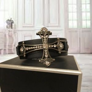 Black leather cuff with studded cross